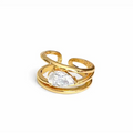 Gold ring with a clear gemstone on a white background